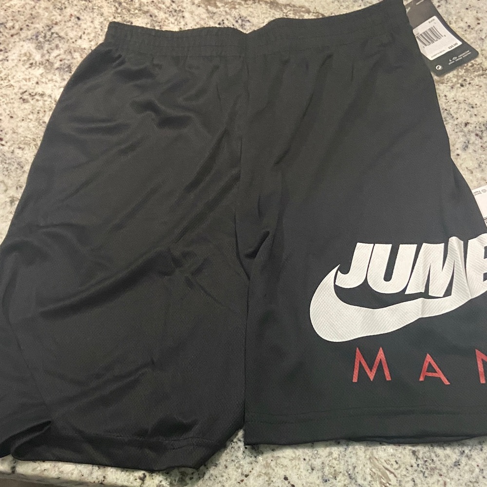 Jordan Black Shorts with White Swoosh and Red 'MAN' Accent